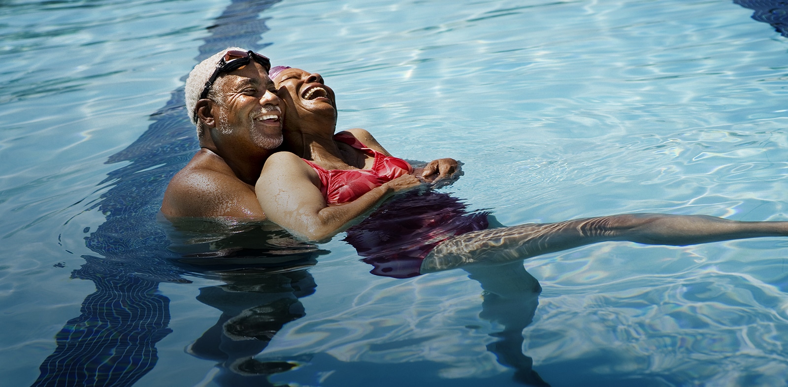 Couple smiling in pool